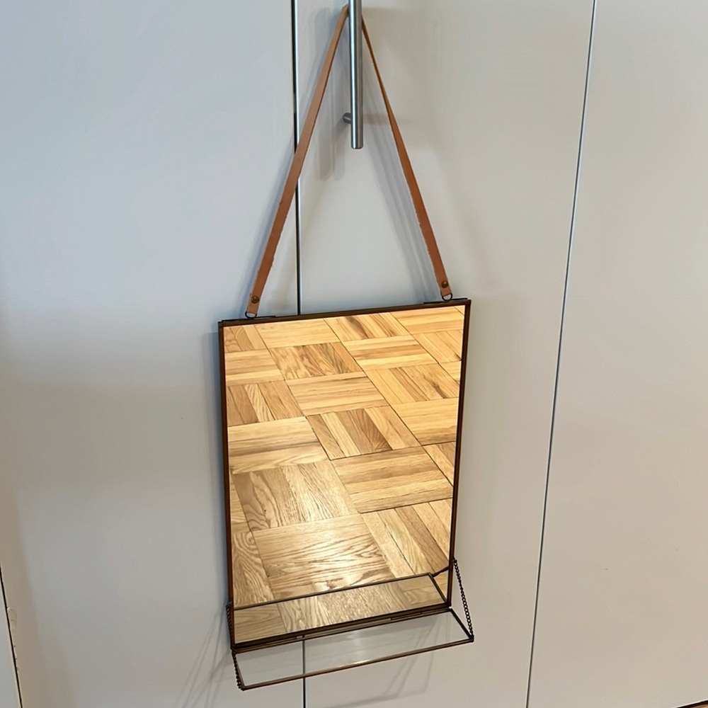 CB2 hanging mirror with glass shelf